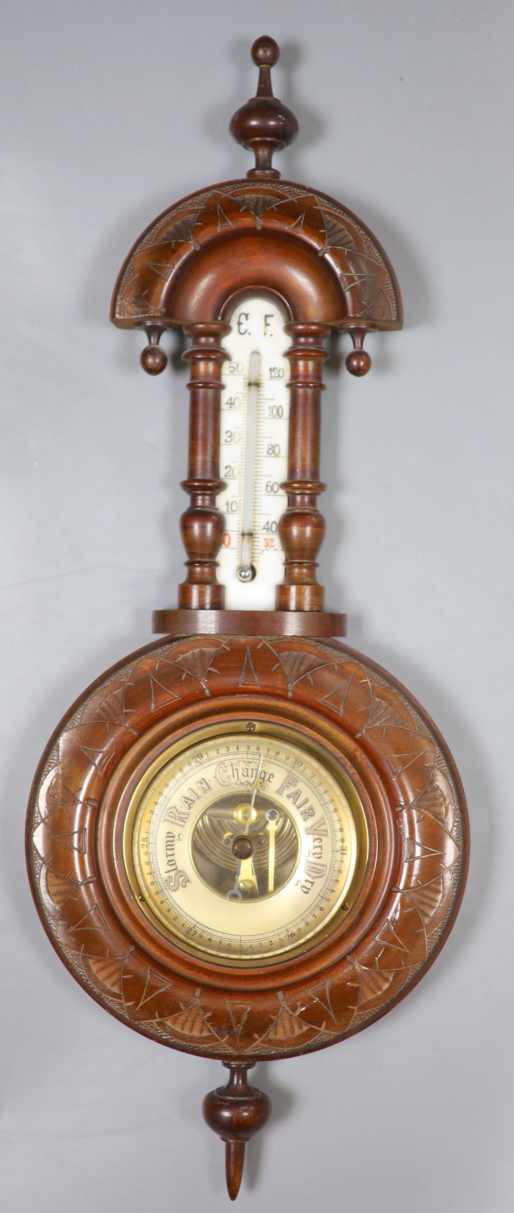 An aneroid barometer together with a 19th century mahogany coffee grinder and an inlaid box